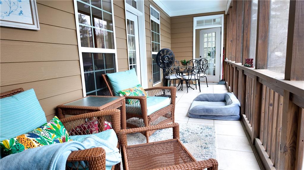 8179 Pineview Court Villa Rica, GA 30180 - Photo 22 of 38 a view of a patio with dining table and chairs