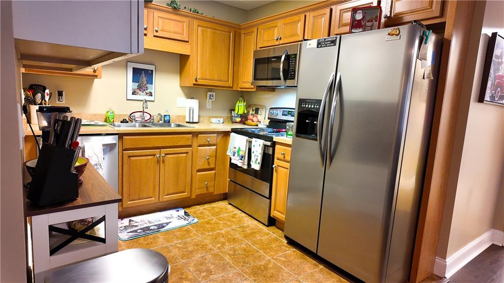 8179 Pineview Court Villa Rica, GA 30180 - Photo 24 of 38 a kitchen with stainless steel appliances a refrigerator sink and microwave