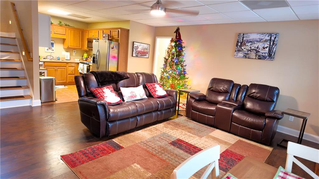 8179 Pineview Court Villa Rica, GA 30180 - Photo 25 of 38 a living room with furniture rug and wooden floor