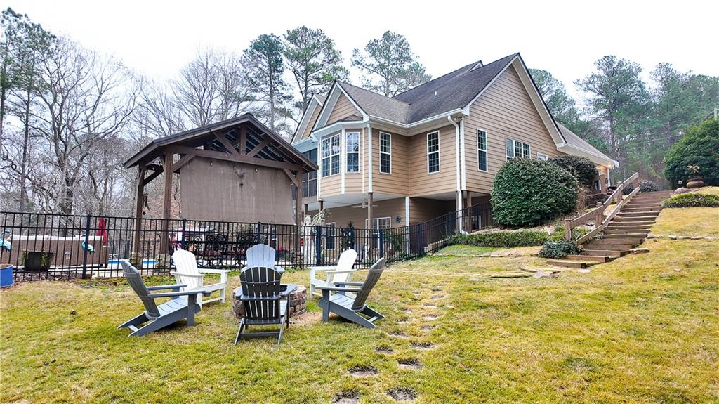 8179 Pineview Court Villa Rica, GA 30180 - Photo 34 of 38 a view of a house with pool and chairs