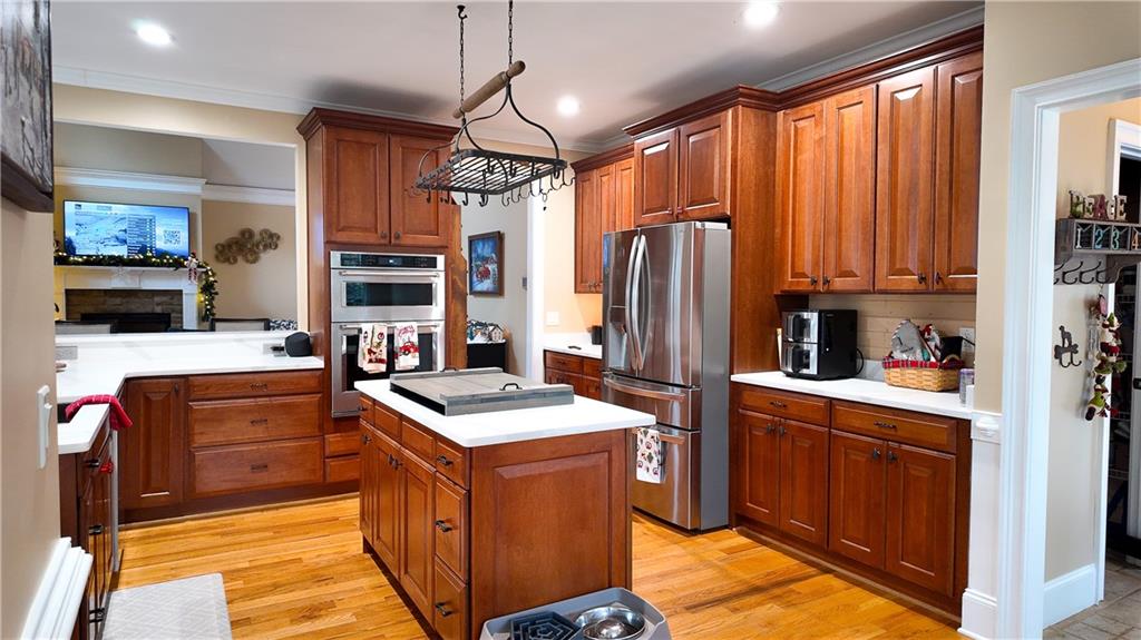 8179 Pineview Court Villa Rica, GA 30180 - Photo 7 of 38 a kitchen with stainless steel appliances granite countertop a refrigerator a stove top oven a sink and dishwasher