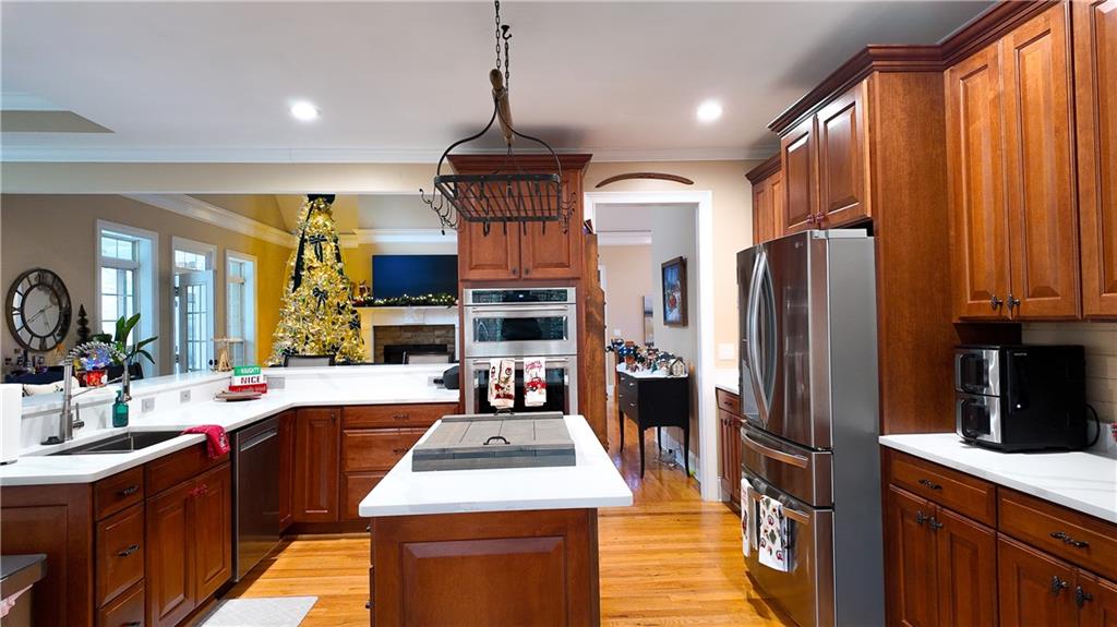 8179 Pineview Court Villa Rica, GA 30180 - Photo 8 of 38 a kitchen with stainless steel appliances a sink stove and refrigerator