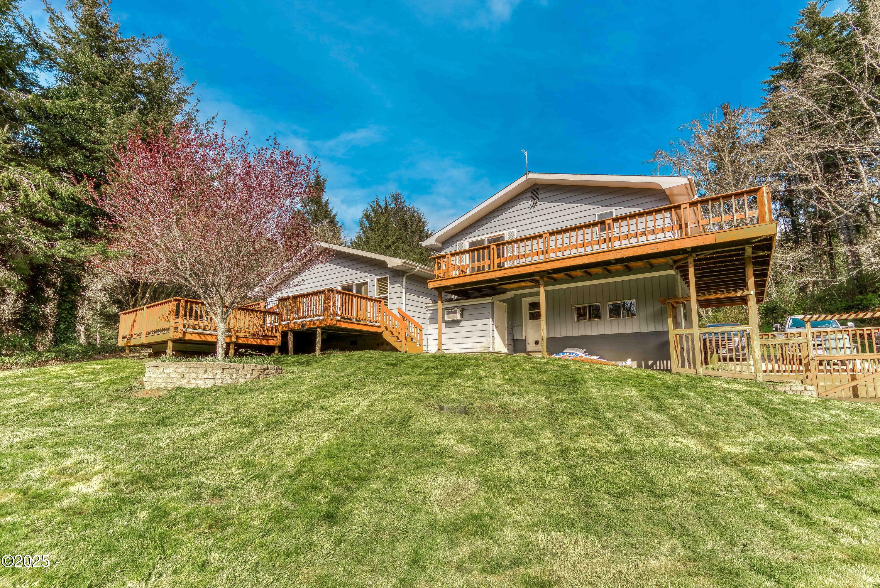 312 Southeast Davis Road Newport, OR 97365 - Photo 1 of 30 Backyard & back of home