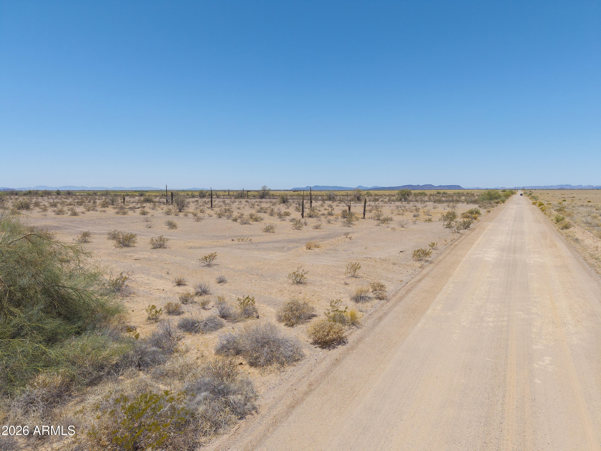 0 West Lahman (approx) Road Dateland, AZ 85333 - Photo 12 of 20 a view of a dry yard with wooden fence