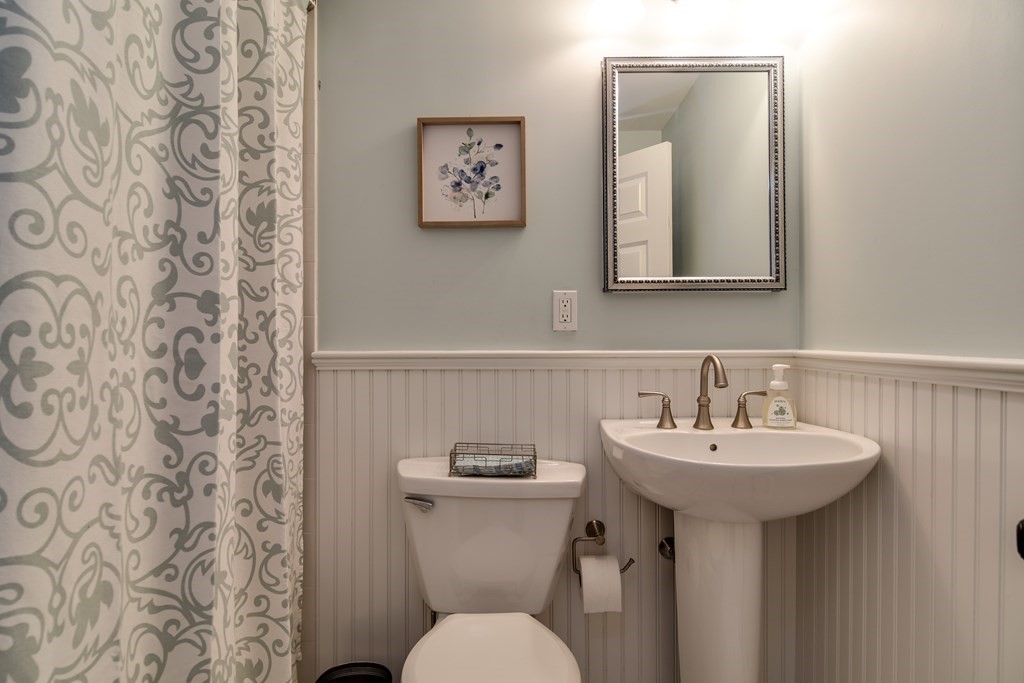 9 Longmeadow Road Medfield, MA 02052 - Photo 12 of 31 a bathroom with a toilet sink and mirror