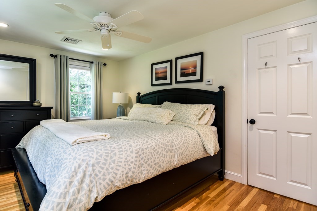 9 Longmeadow Road Medfield, MA 02052 - Photo 13 of 31 a large bed in a bedroom next to a window