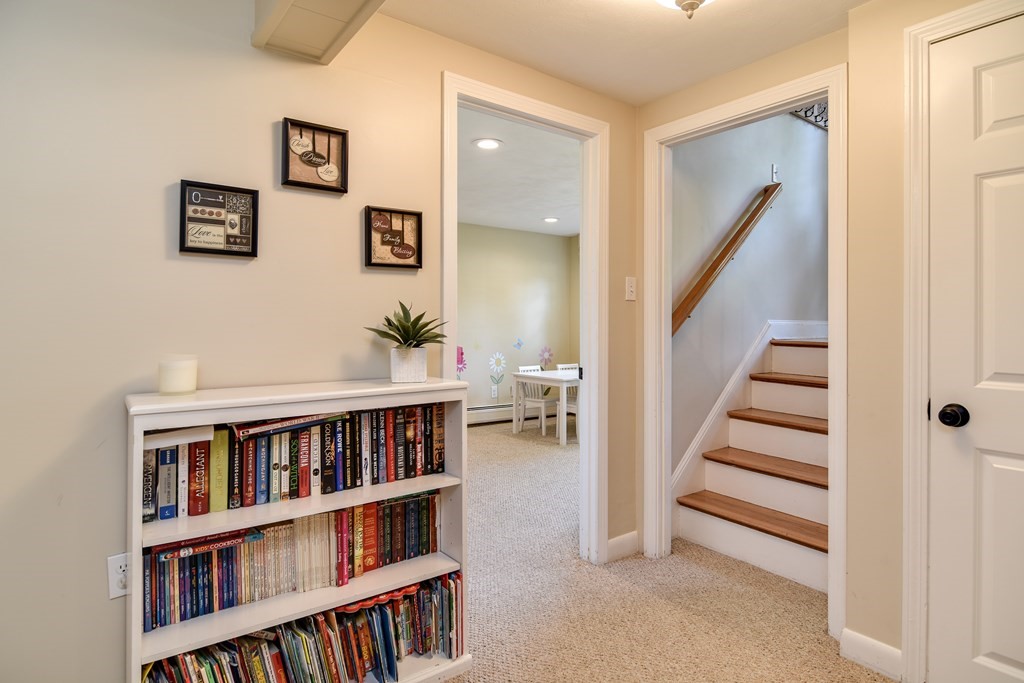 9 Longmeadow Road Medfield, MA 02052 - Photo 17 of 31 a view of a livingroom with furniture and staircase