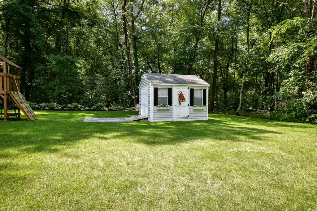 9 Longmeadow Road Medfield, MA 02052 - Photo 27 of 31 a front view of a house with a yard