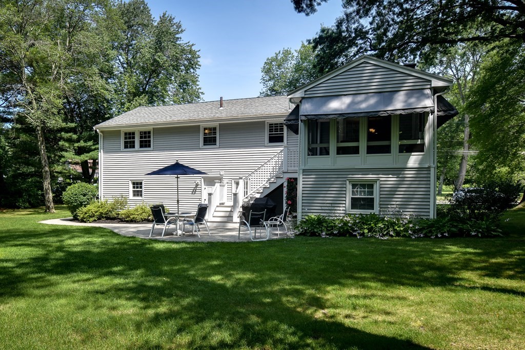 9 Longmeadow Road Medfield, MA 02052 - Photo 29 of 31 a front view of a house with a yard and trees