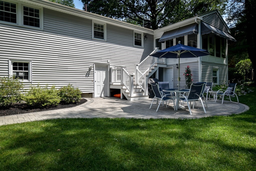 9 Longmeadow Road Medfield, MA 02052 - Photo 30 of 31 a view of a house with a yard chairs and table in patio