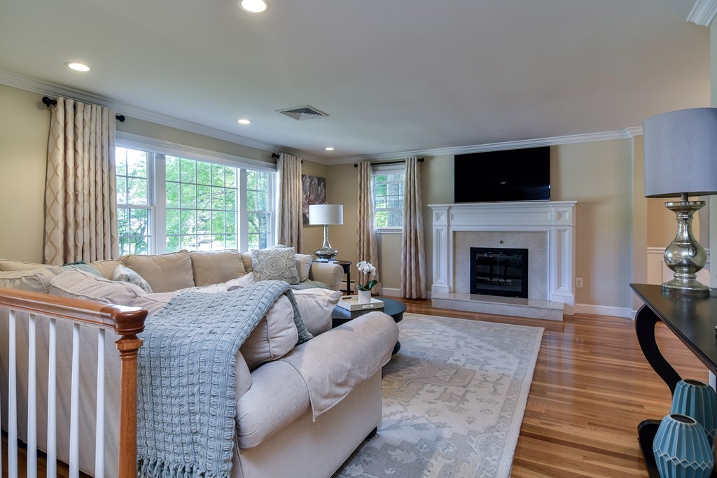 9 Longmeadow Road Medfield, MA 02052 - Photo 3 of 31 a living room with furniture and a fireplace