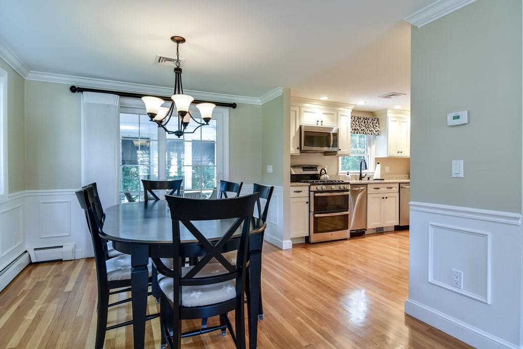9 Longmeadow Road Medfield, MA 02052 - Photo 8 of 31 a view of a dining room with furniture and wooden floor