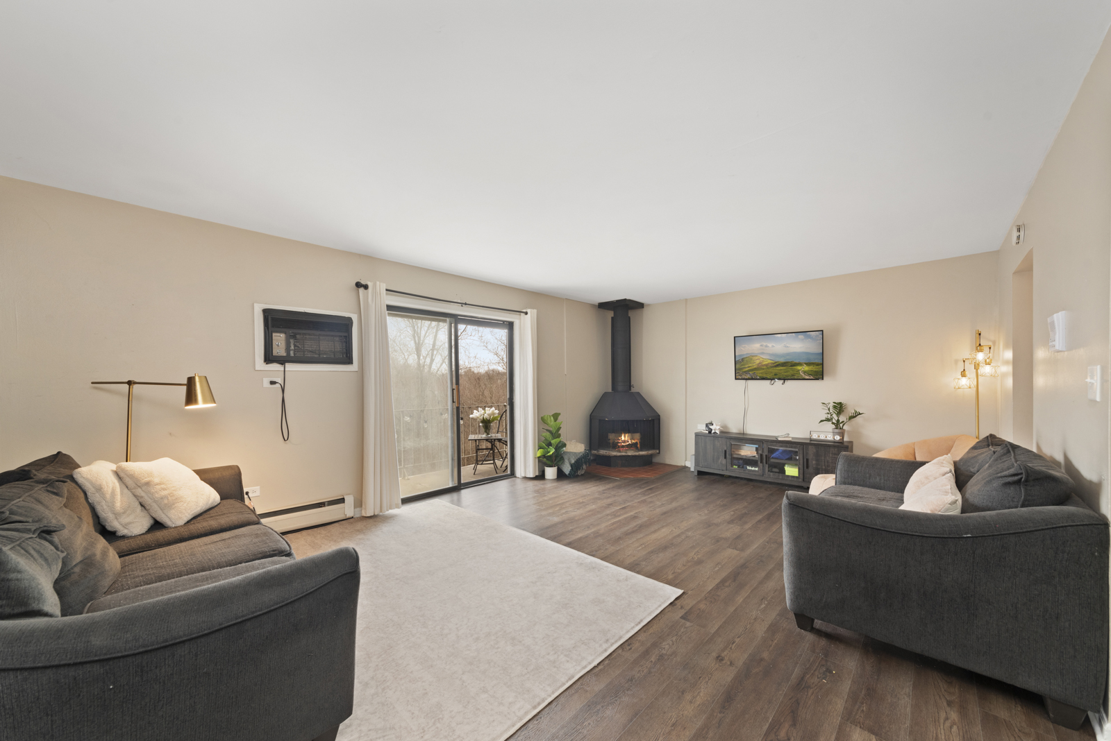 124 East Bailey Road, Unit J Naperville, IL 60565 - Photo 4 of 18 a living room with furniture and wooden floor