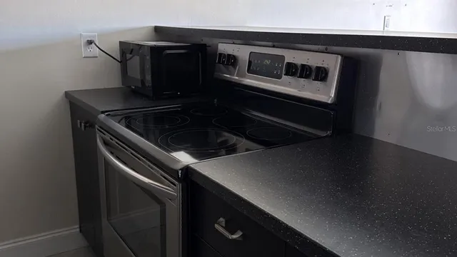 a close view of kitchen sink and stove