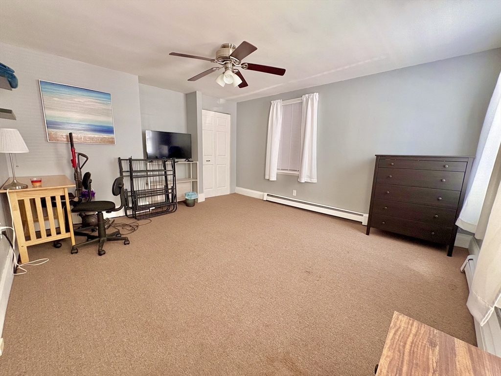 285 Roxbury Street Boston, MA 02119 - Photo 8 of 15 a view of a room with gym equipment and a large window