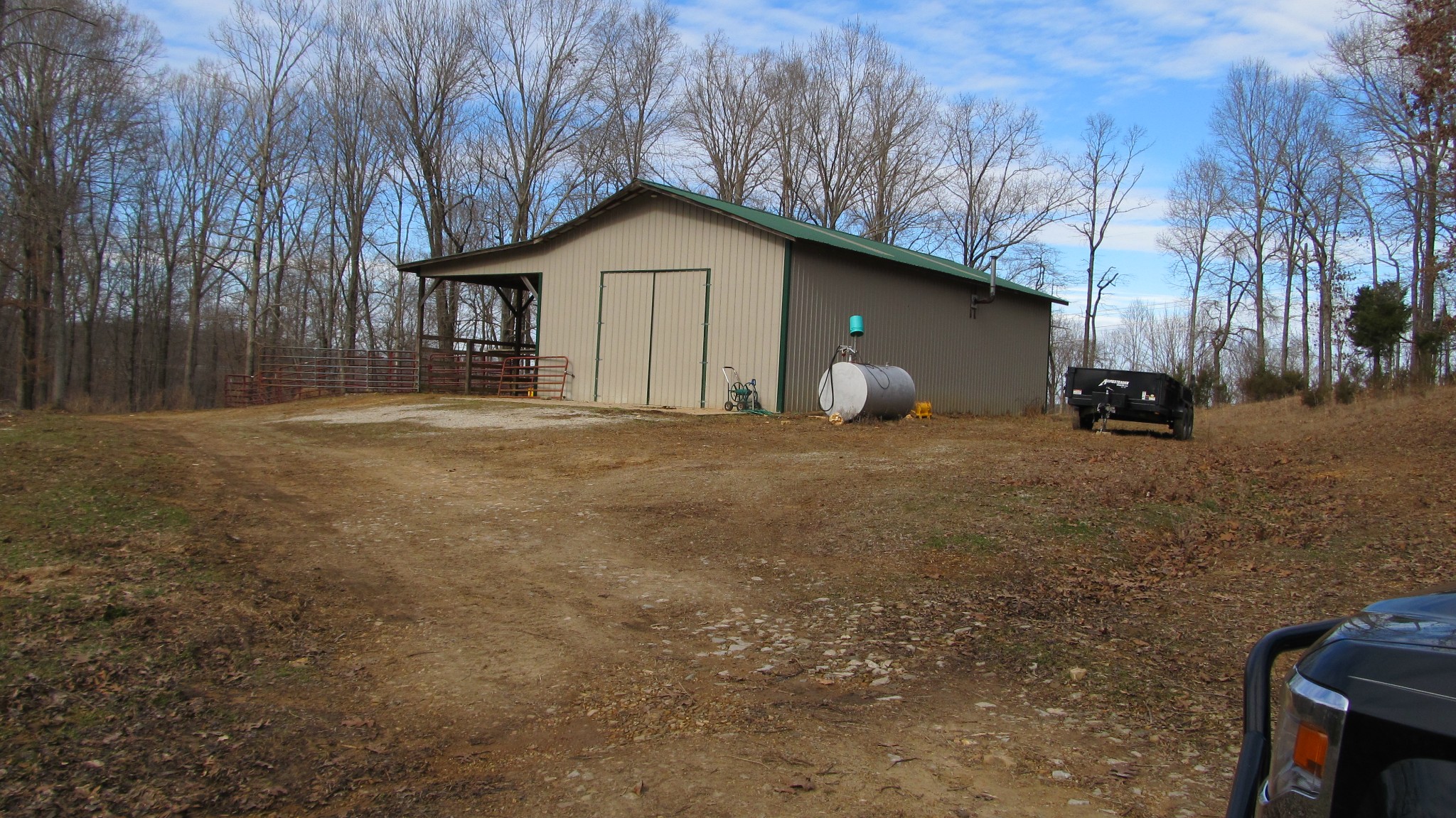 776 Norris Hollow Road Vanleer, TN 37181 - Photo 11 of 52 a big house with large trees and wooden fence