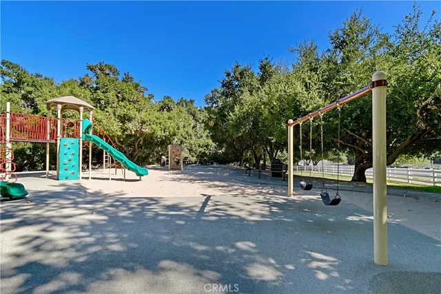 a view of a park with a slide