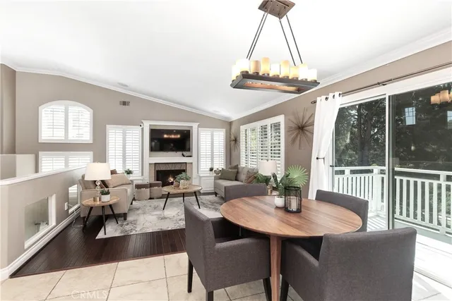 a living room with furniture a table and a chandelier