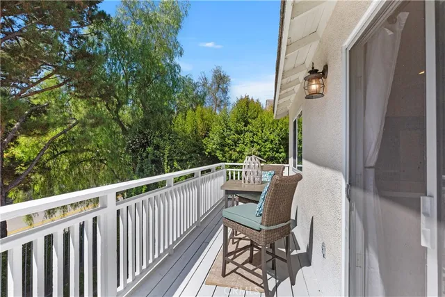a view of a balcony with furniture