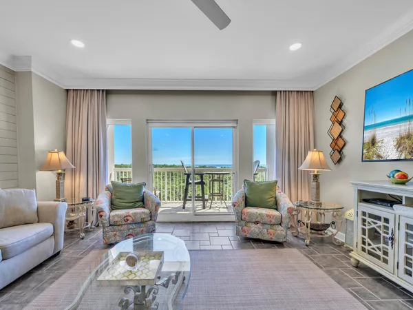 a living room with furniture and a lamp