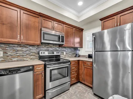a kitchen with a stove oven and sink