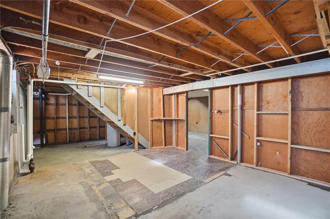 1087 Fairfield Road Troy, OH 45373 - Photo 27 of 39 Unfinished basement offering ample space, ideal for storage or future expansion.