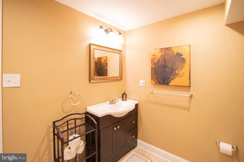 2107 Carpenter Street Philadelphia, PA 19146 - Photo 16 of 24 a bathroom with a sink and a mirror