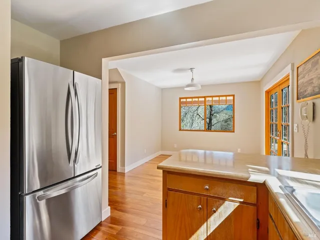 a kitchen with stainless steel appliances a refrigerator and a sink
