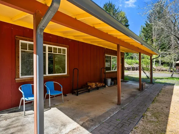 a backyard of a house with seating space
