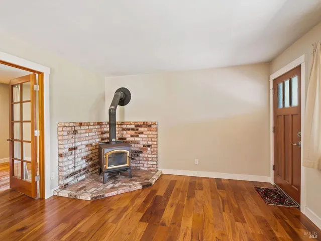 a view of a livingroom with wooden floor
