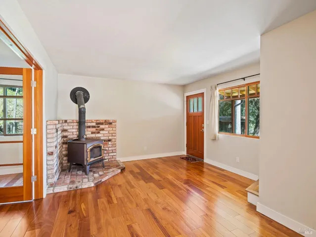 a view of a livingroom with furniture and workspace