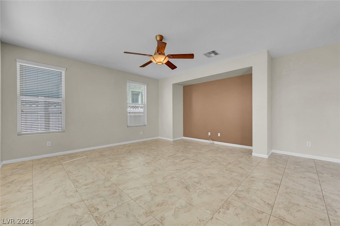 977 Sparkling Light Street Henderson, NV 89052 - Photo 26 of 75 This spacious living area offers bright windows and tiled floors for comfortable daily living.