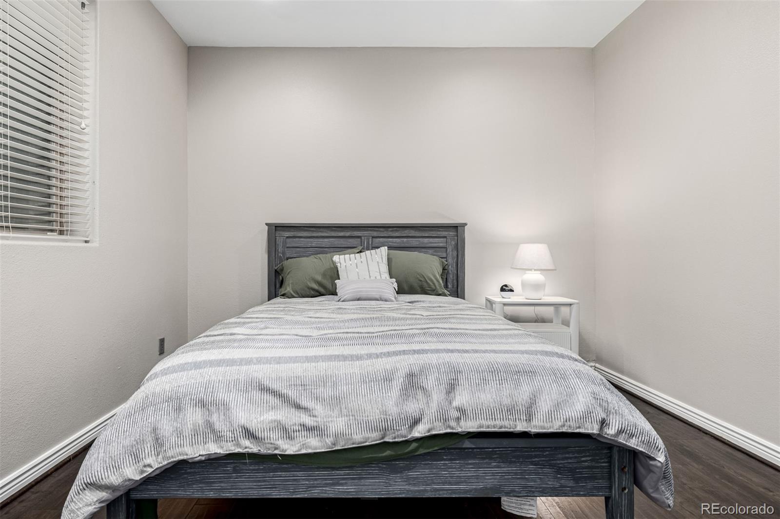 15501 East 112th Avenue, Unit 34C Commerce City, CO 80022 - Photo 15 of 18 a bedroom with a bed and a window