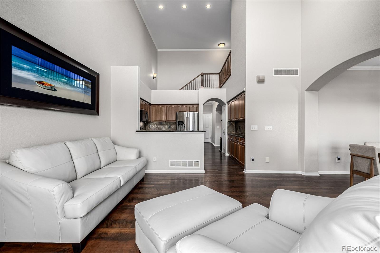 15501 East 112th Avenue, Unit 34C Commerce City, CO 80022 - Photo 5 of 18 a living room with furniture and a painting