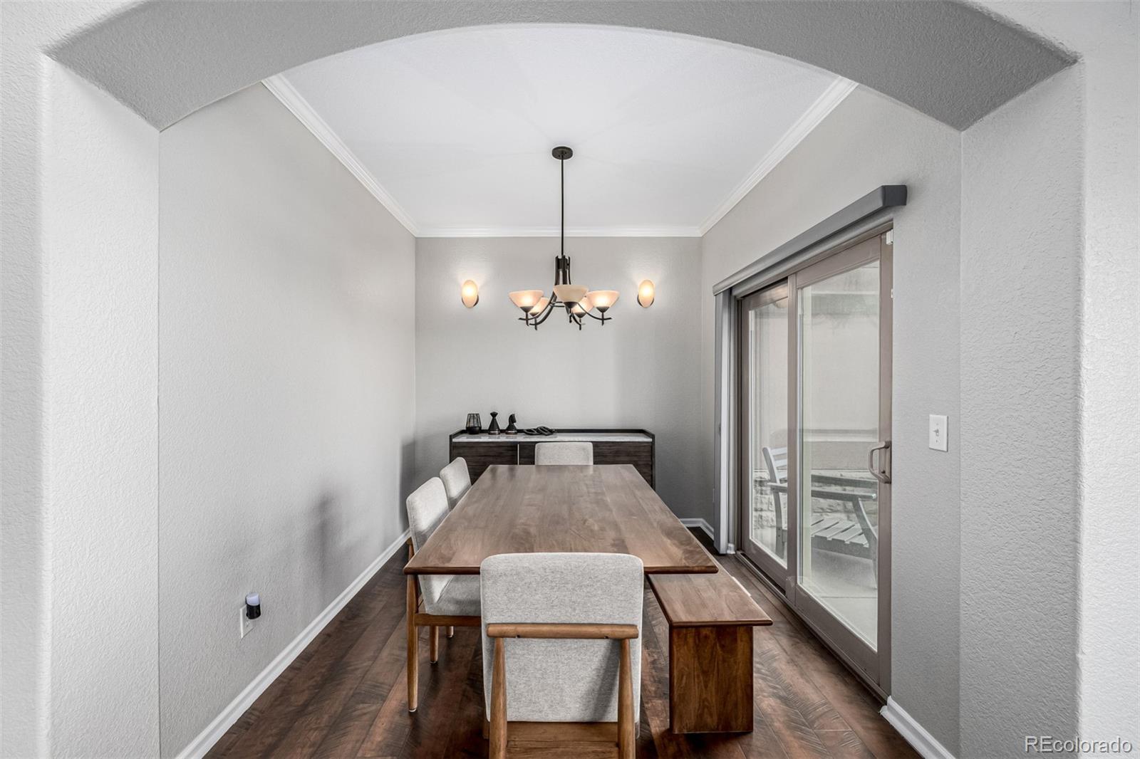 15501 East 112th Avenue, Unit 34C Commerce City, CO 80022 - Photo 6 of 18 a view of a hallway with furniture and chandelier