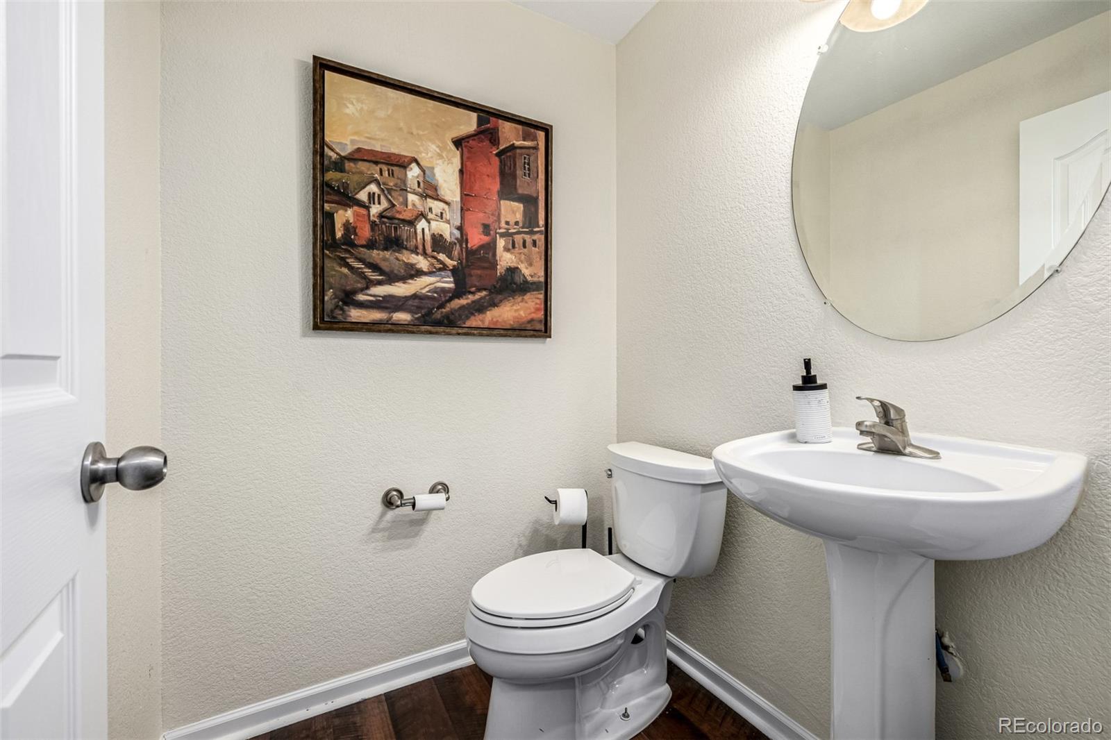 15501 East 112th Avenue, Unit 34C Commerce City, CO 80022 - Photo 8 of 18 a bathroom with a sink mirror and toilet
