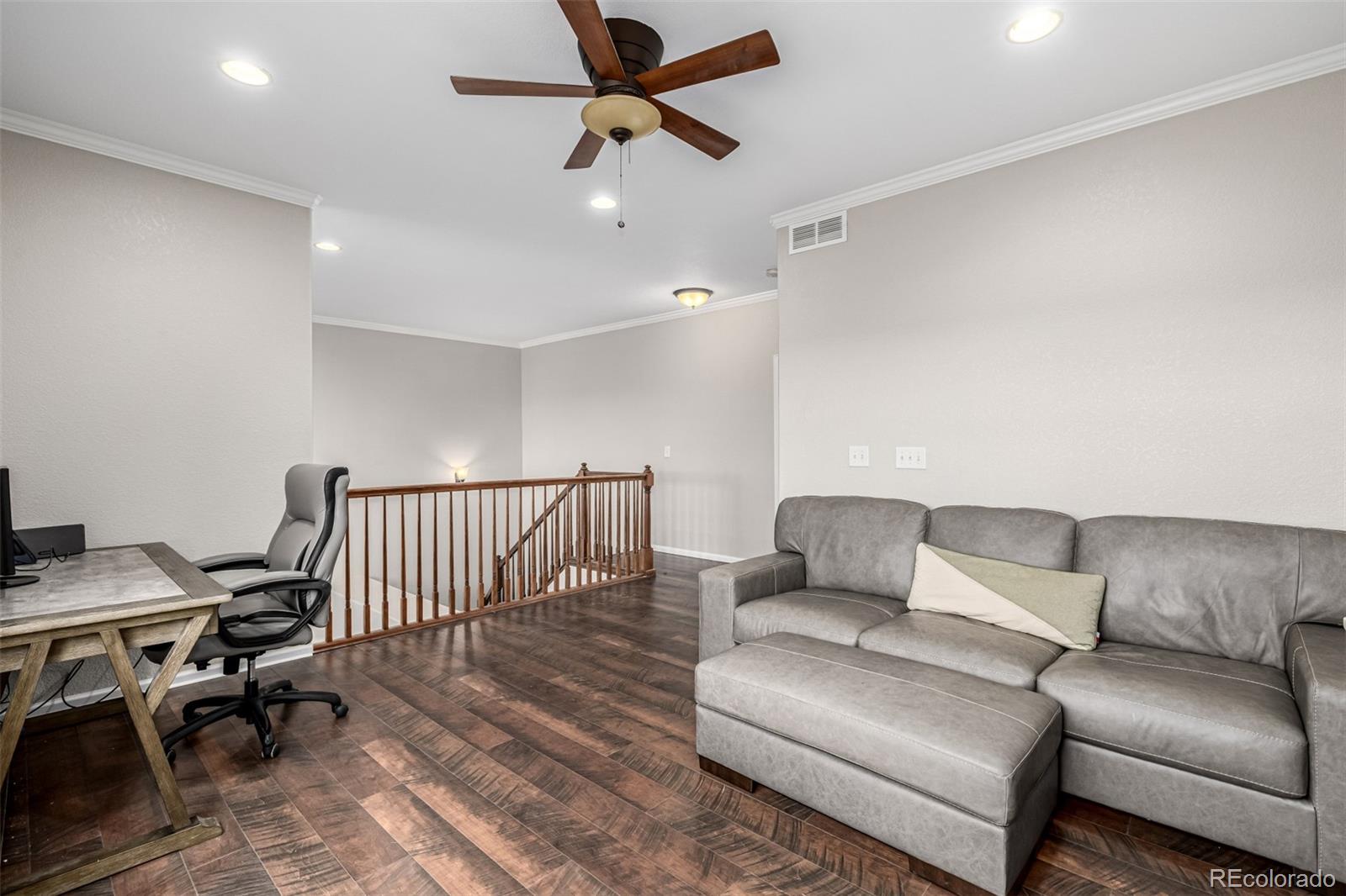 15501 East 112th Avenue, Unit 34C Commerce City, CO 80022 - Photo 9 of 18 a living room with furniture
