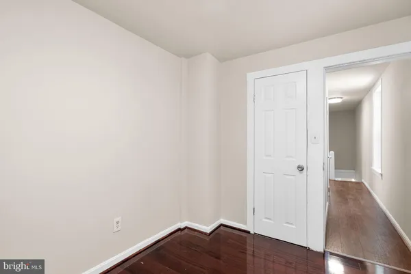an empty room with wooden floor