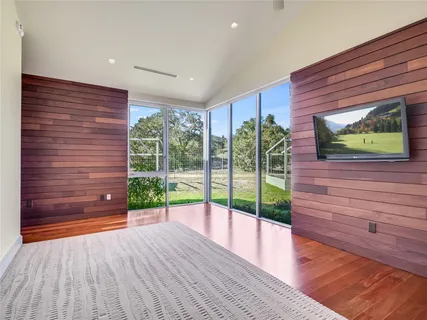 a bathroom with a double vanity sink toilet mirror and shower