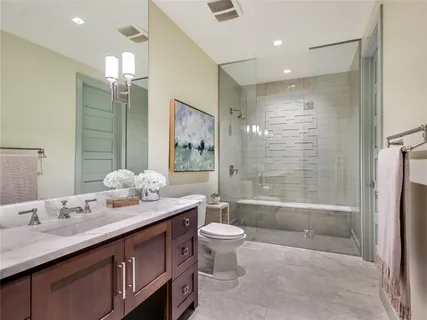 a view of backyard with tub and door