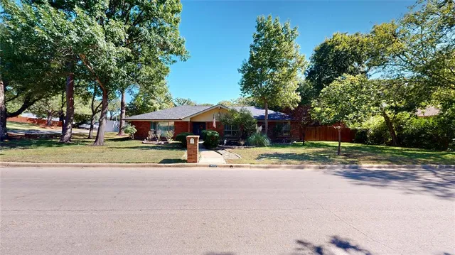 a house view with a garden space