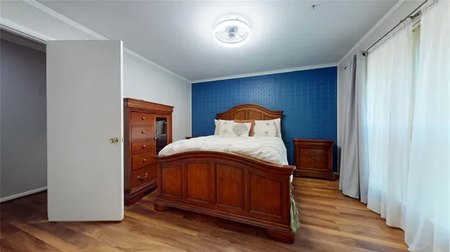 a bedroom with a bed and a closet