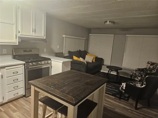 a kitchen with a stove and a cabinets