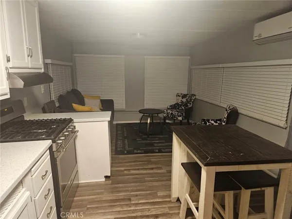 a kitchen with a sink and a stove top oven