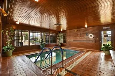 a swimming pool with outdoor seating and yard