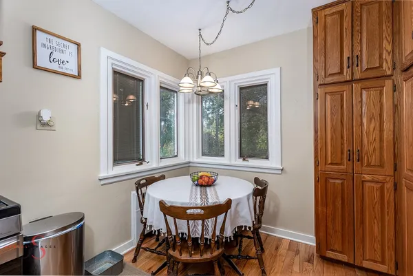 a dining room with furniture and window
