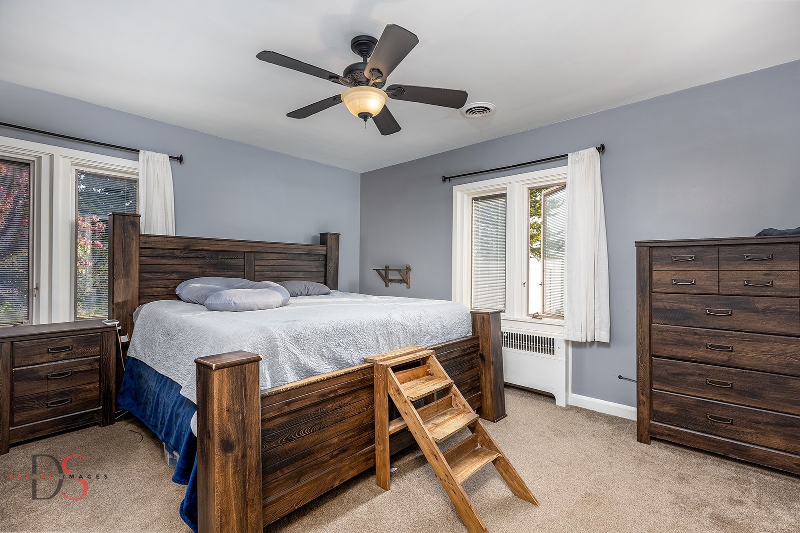 1508 East 18th Road Streator, IL 61364 - Photo 14 of 27 a bedroom with a bed and a chandelier