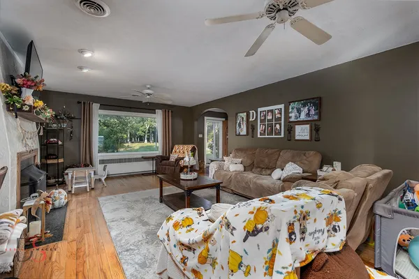 a bedroom with furniture and a wooden floor