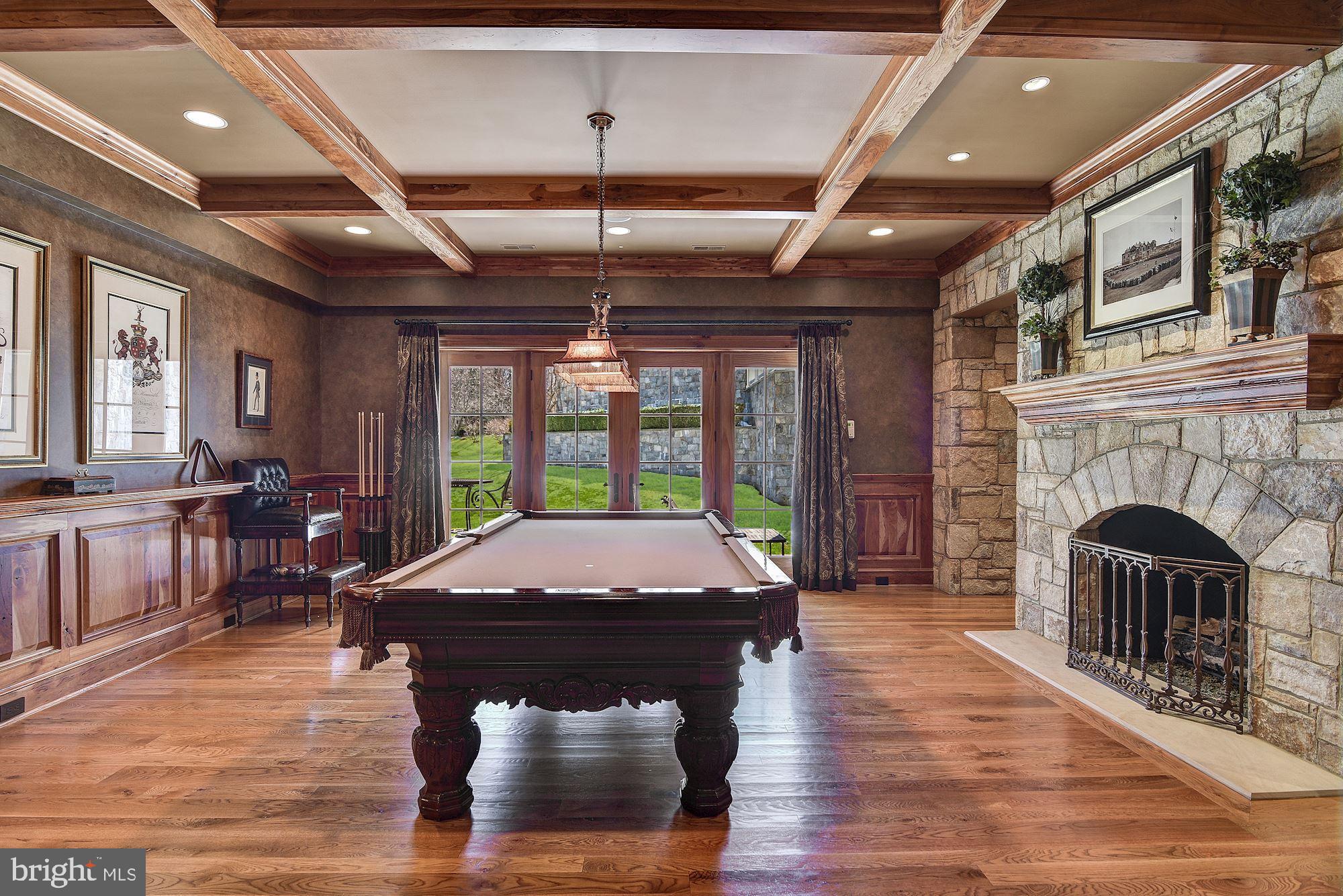 733 Springvale Road Great Falls, VA 22066 - Photo 48 of 74 Billiards Room with floor-ceiling stone wall, FP