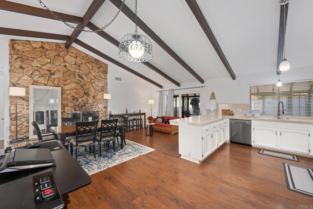 16273 Arena Drive Ramona, CA 92065 - Photo 15 of 67 a large white kitchen with lots of counter top space and stainless steel appliances